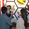 Mario Gonzalez speaks with a pair of mural admirers.